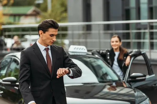 A picture of one of our chauffeurs arriving on time to pick up a customer