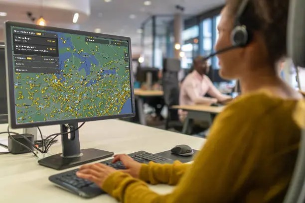 A picture of one of our staff tracking our customers flight status to check for any delays to update customer's trip accordinly.